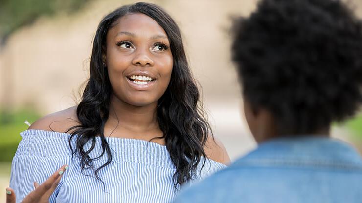 Two African-American female students talking